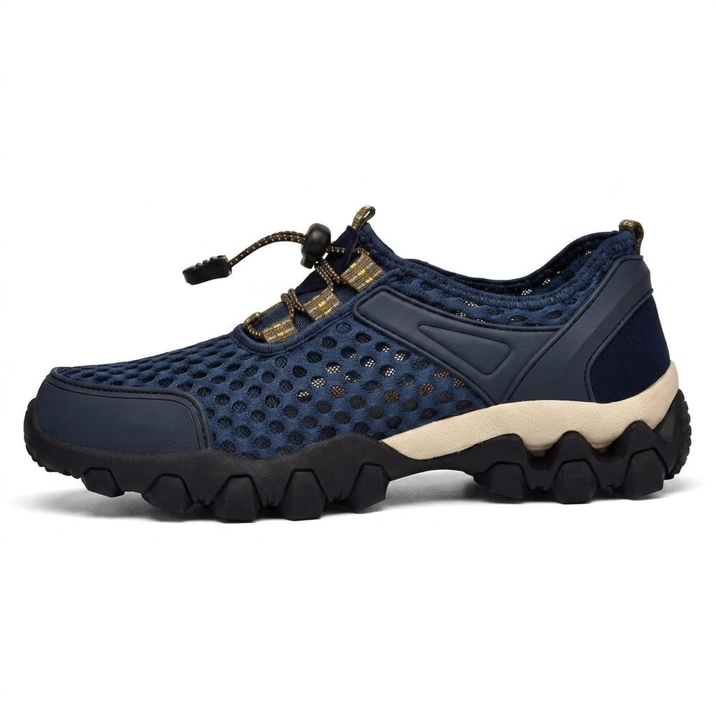 Zapatilla náutica de hombre en azul marino, malla transpirable y suela de tacos, vista lateral
